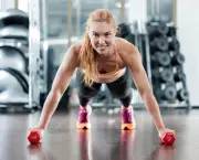 Woman push-ups on the floor at the gym