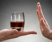 Businessman Rejecting Whisky Offered By Businessperson