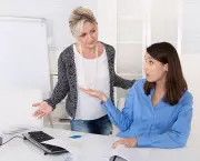 Business woman having problems at work: bullying, mobbing, herassment at workplace.